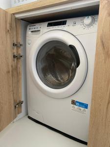 a white washing machine in a small room at Apartamento nuevo y moderno in San Bartolomé