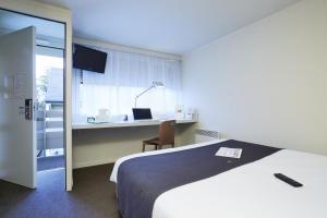 Postel nebo postele na pokoji v ubytování Campanile Lille Sud - CHR