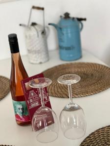 a table with a bottle of wine and two glasses at Meerdesign - 8 Personen - zwischen Mannheim und Heidelberg in Ladenburg