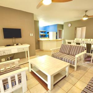 a living room with a couch and a table at The Bridge Apartments Unit 35 in St Lucia