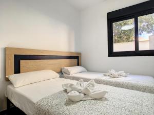 Ένα ή περισσότερα κρεβάτια σε δωμάτιο στο Elisa Beach Apartment - 8209 +41 φωτογραφίες