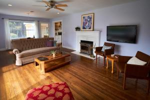 a living room with a couch and a fireplace at Fabulous Home W Outdoor Kitchen, Fire Pit And Back Yard! in Morristown