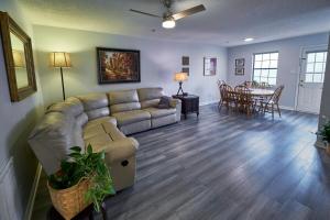 a living room with a couch and a table at Cozy Quiet 2 Bedroom 2 Bath Townhome W Kitchen, Patio in Knoxville