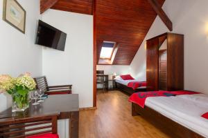 Posteľ alebo postele v izbe v ubytovaní Hotel Beskid