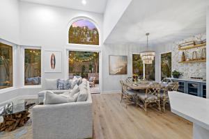 a living room with a table and a dining room at Dana Point Deluxe in Dana Point