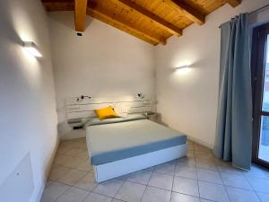 Postel nebo postele na pokoji v ubytování La corte in Franciacorta