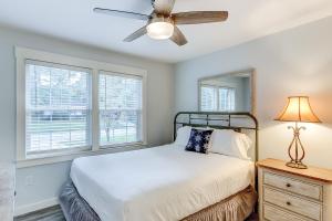 a bedroom with a bed and a ceiling fan at Pleasant Dreams in Charleston