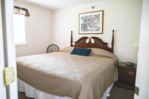 a bedroom with a large bed and a window at The Garrison in Wells