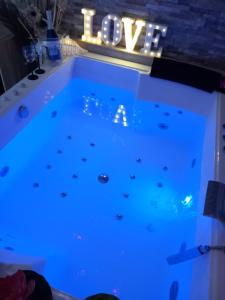 a swimming pool with blue lights in a room at Mary Gery's Rooms in Castellammare del Golfo