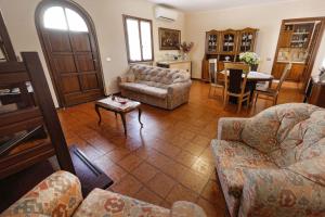 a living room with a couch and a table at La casa di Mario e Olga in San Martino