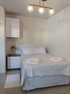 Tempat tidur dalam kamar di EL SHADDAY HOTEL
