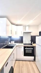 Kuchyňa alebo kuchynka v ubytovaní Résidence Anthérieu - Appartements neufs tout confort