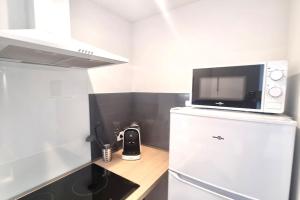 Kuchyňa alebo kuchynka v ubytovaní Résidence Anthérieu - Appartements neufs tout confort