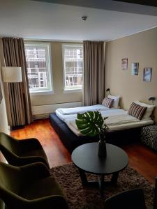 Postel nebo postele na pokoji v ubytování First Hotel Millennium