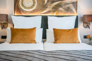 Postel nebo postele na pokoji v ubytování Leonardo Royal Hotel Barcelona Fira