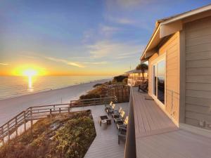 a balcony of a house with a view of the beach at Nifty Shades Of Gray Home in Inlet Beach