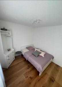 Ένα ή περισσότερα κρεβάτια σε δωμάτιο στο Appartamento Wyss