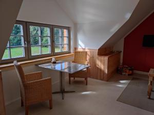 TV a/nebo společenská místnost v ubytování Ferienhaus am Himberg