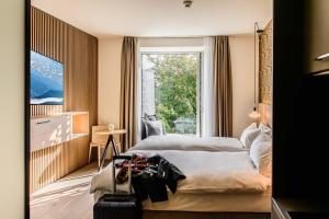 Una cama o camas en una habitación de Afterwork Hotel 37 fotos más