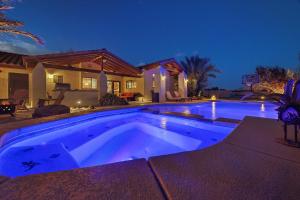 a swimming pool in front of a house at Luxury villa with pool and spa in Las Vegas