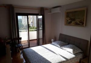 Postel nebo postele na pokoji v ubytování Apartman Buble