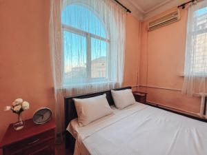 Posteľ alebo postele v izbe v ubytovaní Apartments On Kreshchatik 17
