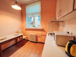 Kuchyňa alebo kuchynka v ubytovaní Apartments On Kreshchatik 17