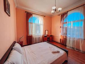 Posteľ alebo postele v izbe v ubytovaní Apartments On Kreshchatik 17