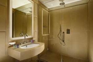 a bathroom with a sink and a shower at Hotel Balestri - WTB Hotels in Florence