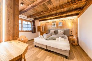 Posteľ alebo postele v izbe v ubytovaní Chalet Catinaccio Rosengarten 18