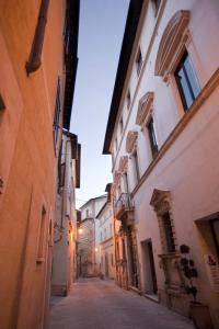 an alley in an old town with buildings at Palazzo Carletti in Montepulciano