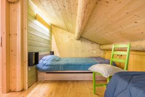 Letto o letti in una camera di Baita Dani