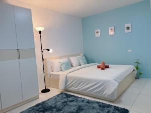 Letto o letti in una camera di The 4 Blocks at Kata noi
