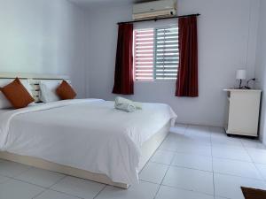 Letto o letti in una camera di The 4 Blocks at Kata noi
