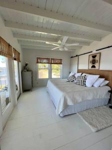 a bedroom with a large bed in a room at Write on the Bay, a Waterfront Retreat in Coastal Alabama in Fairhope