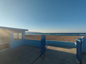 a view of the beach from the balcony of a house at Hotel Tsagarakis Beach in Amoudara Herakliou