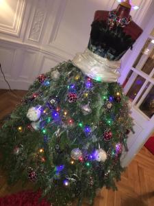 a christmas tree with christmas lights on it at GUESTHOUSE La VILLAE in Mazamet