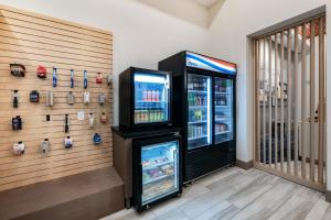 a soda machine in a store with a refrigerator at Holiday Inn Express & Suites - Lincoln Downtown , an IHG Hotel in Lincoln