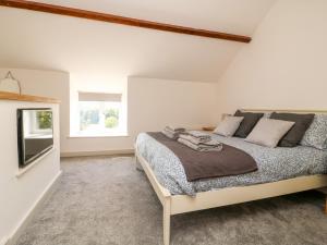 Katil atau katil-katil dalam bilik di Yon Cottage