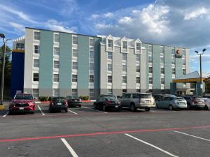 a large building with cars parked in a parking lot at Comfort Inn & Suites in Staunton