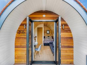 an archway leading to a room with a bed at Oak-uk36258 in Llanfair Caereinion