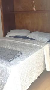 Uma cama ou camas num quarto em Le Premier Niterói Apart Hotel