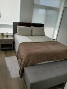 a bedroom with a large bed with a window at Midtown 4 bedroom home Free Wi-Fi and parking in Toronto