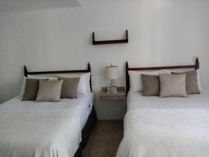Postel nebo postele na pokoji v ubytování Hotel Posada Santa Fe