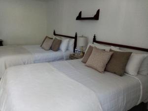 Postel nebo postele na pokoji v ubytování Hotel Posada Santa Fe