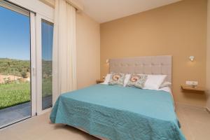 Posteľ alebo postele v izbe v ubytovaní Spartakos Luxury Villa 1 + 16 fotografií