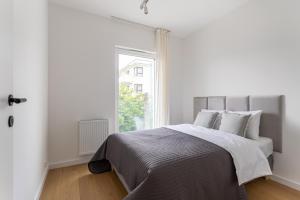 Posteľ alebo postele v izbe v ubytovaní S35 Apartments Gdynia Orłowo