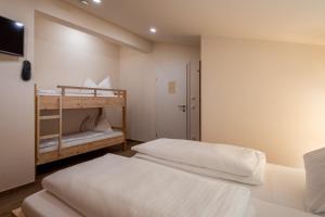 Łóżko lub łóżka w pokoju w obiekcie Penthouse „Das Besenhaus“