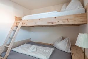 Łóżko lub łóżka w pokoju w obiekcie Penthouse „Das Besenhaus“