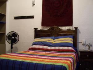 Ein Bett oder Betten in einem Zimmer der Unterkunft Hostal Mixteco Naba Nandoo